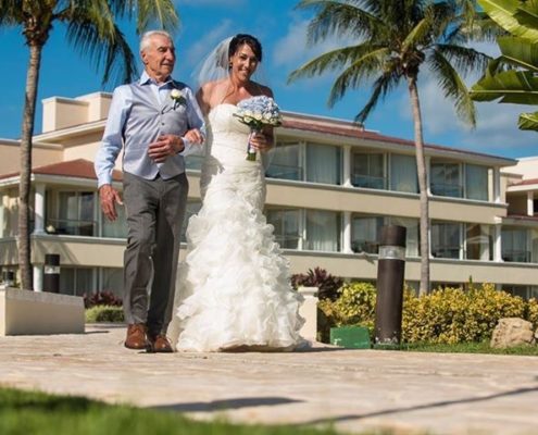 father walks bride to wedding ceremony