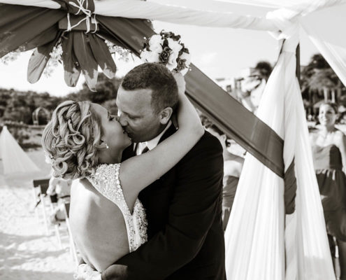 bride and groom kiss after ceremony