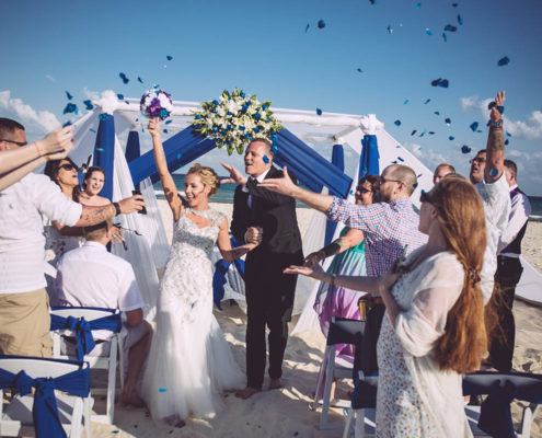 wedding guests celebrate the wedded couple.