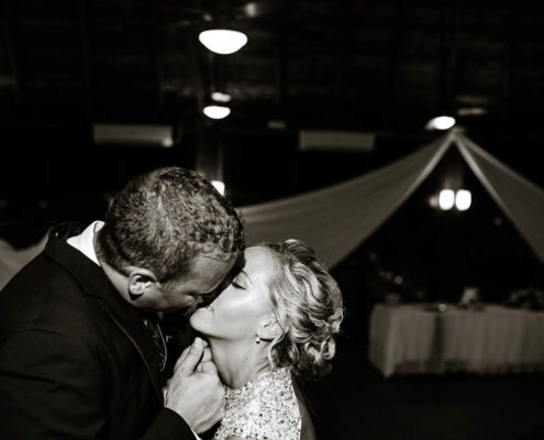 bride and groom after wedding ceremony in front of reception tent.