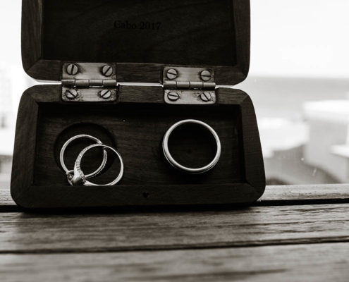 wedding rings with beach in background