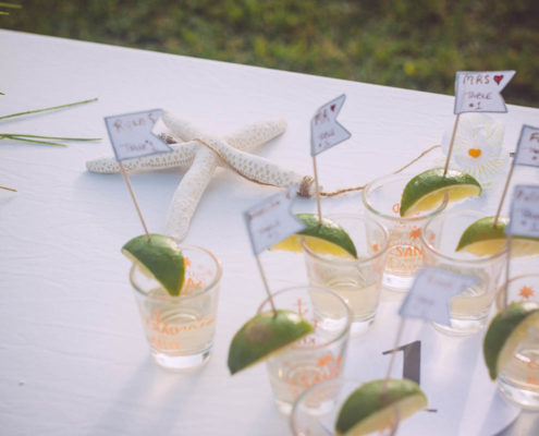 drinks with lime wedges on table